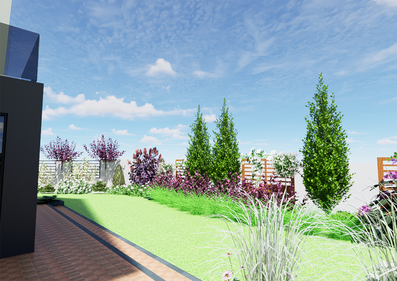 rabata koło domu z kolumnowymi drzewami i kwitnącymi krzewami