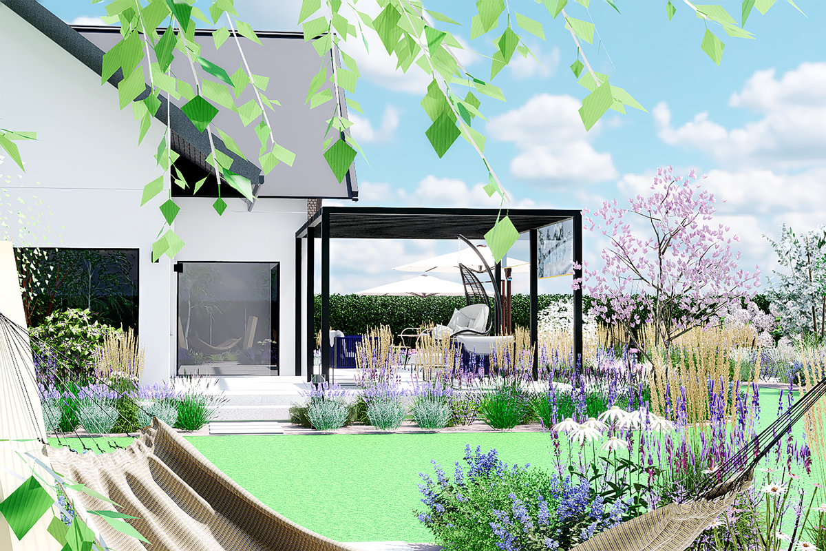 widok na zaprojektowany ogród - część rekreacyjna z tarasem wśród rabat z bylinami