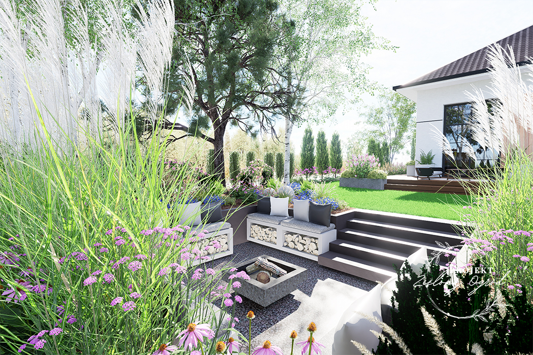 Ogród pod Warszawą z wgłębnikiem na ognisko i kilkoma miejscami do siedzenia w otoczeniu traw ozdobnych